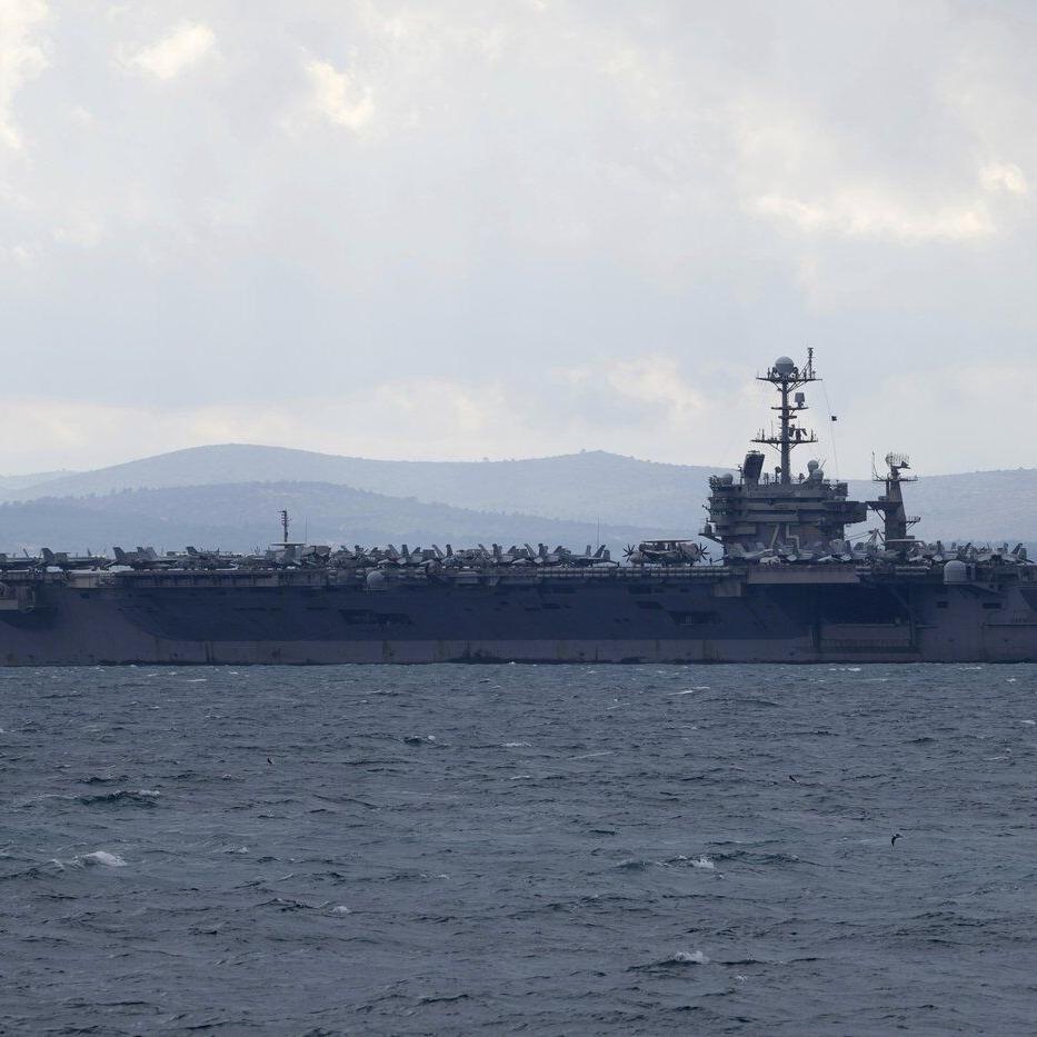 Fighter jet slips off the hangar deck of a US aircraft carrier in the Red Sea, one minor injury